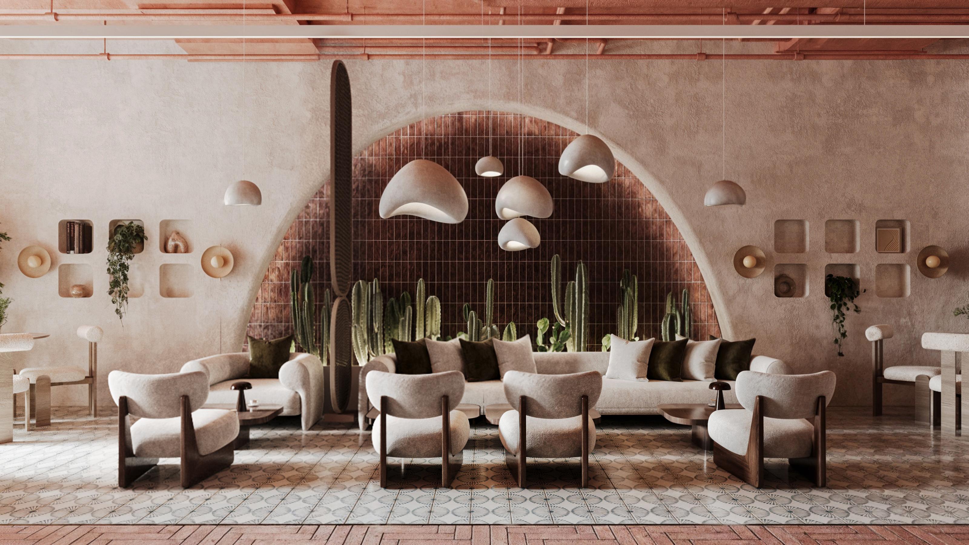 The Vogo Lounge main arch — rose-tiled niche with cactus wall, curved sofa and sculptural pendant lights
